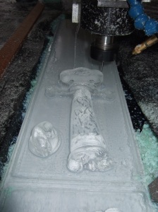 Photo showing a relief representation of the hunting knife being carved 